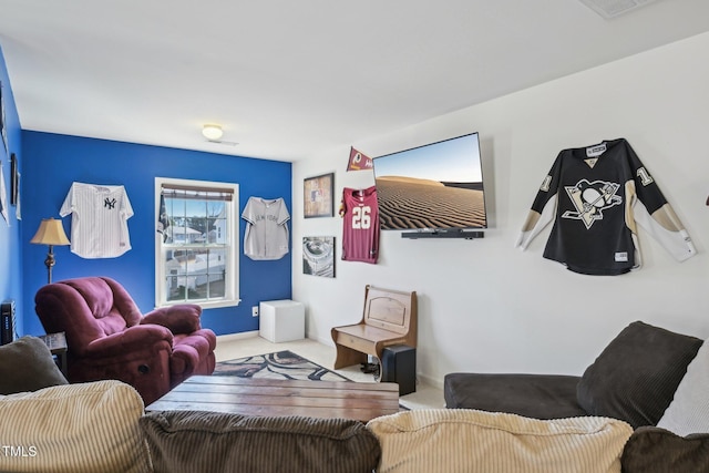 carpeted living area with baseboards and visible vents