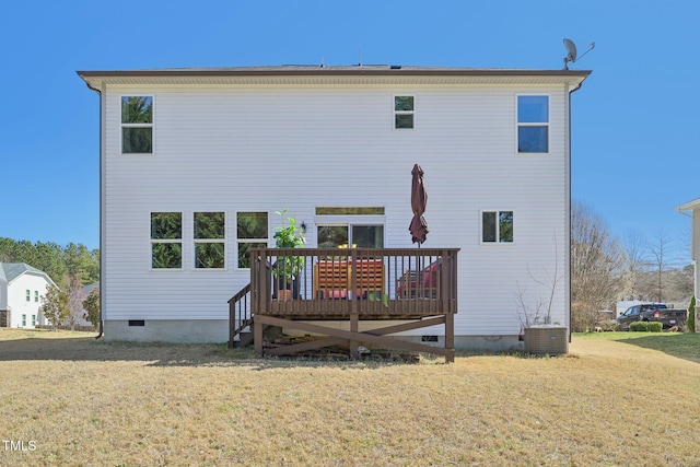 back of property featuring a wooden deck, central air condition unit, a lawn, and crawl space