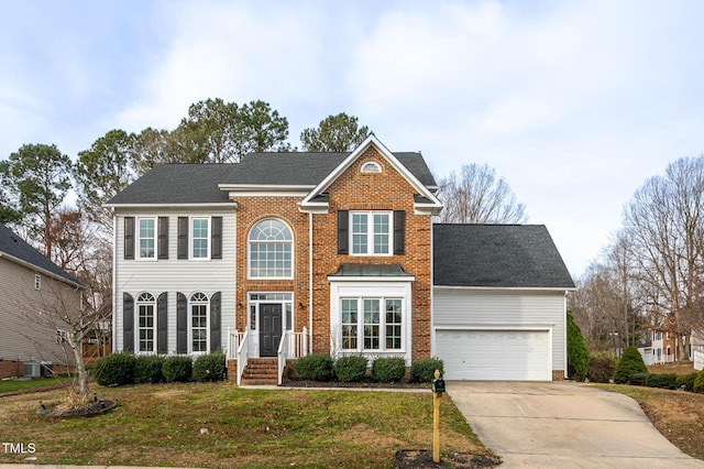 colonial-style house with brick siding, concrete driveway, central AC unit, a garage, and a front lawn