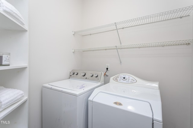 laundry room with washing machine and dryer and laundry area