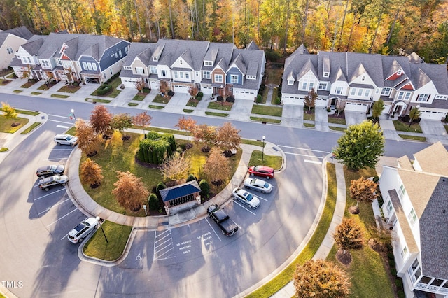 birds eye view of property featuring a residential view and a view of trees