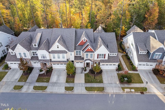 birds eye view of property with a residential view and a view of trees