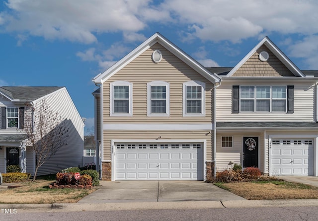 view of front of home featuring an attached garage and concrete driveway