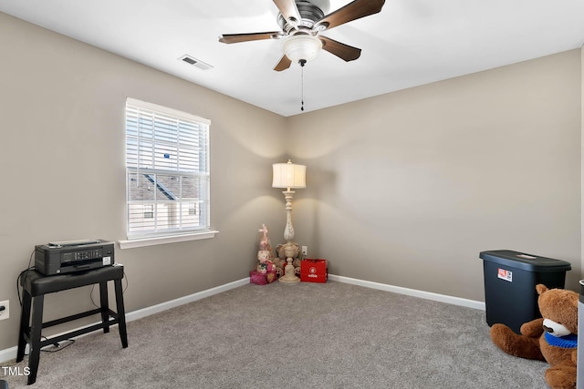 game room with carpet floors, a ceiling fan, visible vents, and baseboards