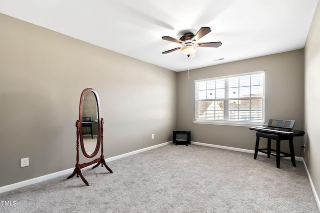 misc room featuring carpet flooring, ceiling fan, visible vents, and baseboards