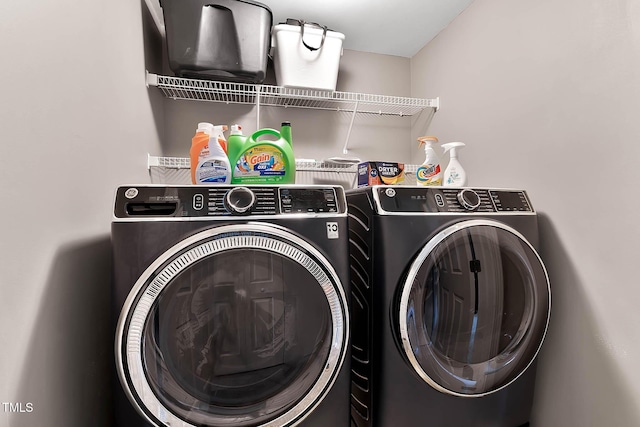 clothes washing area featuring laundry area and independent washer and dryer