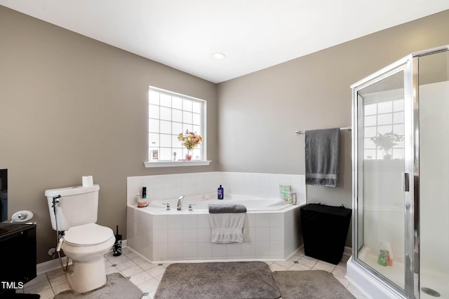 bathroom featuring toilet, a garden tub, a shower stall, and tile patterned floors