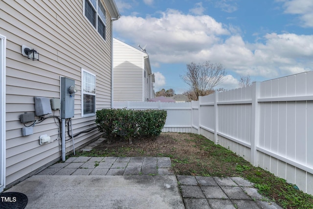 view of yard featuring a patio and fence