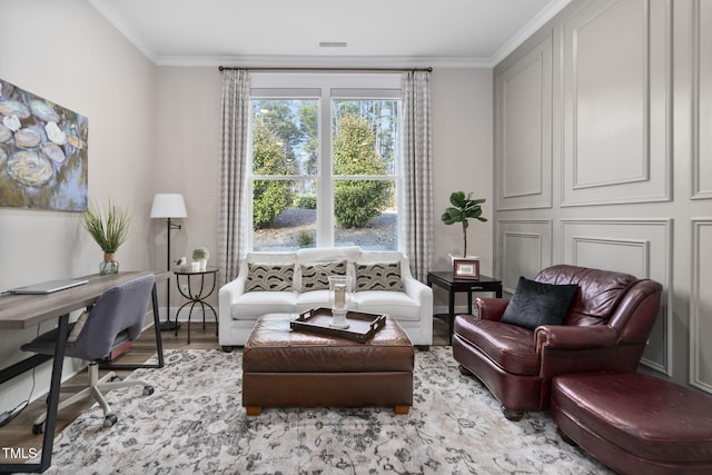 living area with ornamental molding, visible vents, baseboards, and wood finished floors