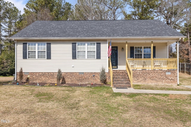 view of front of property with a shingled roof, a front lawn, covered porch, and crawl space