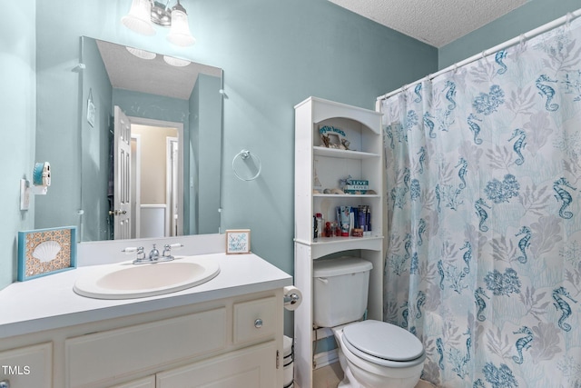 bathroom featuring toilet, a textured ceiling, vanity, and a shower with curtain