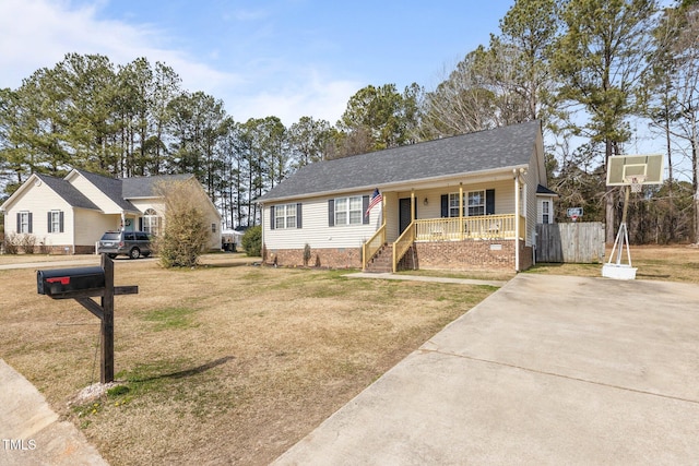 view of front of home with a porch and a front yard