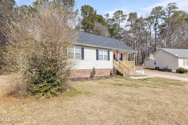 view of front facade featuring a front lawn, central air condition unit, and a shingled roof