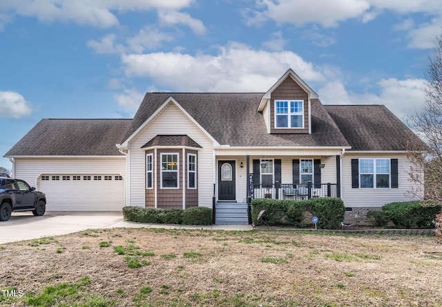 new england style home with a garage, roof with shingles, a porch, and driveway