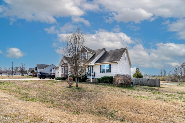 view of front of property featuring fence