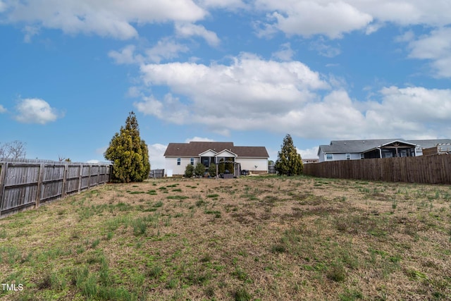 view of yard with a fenced backyard