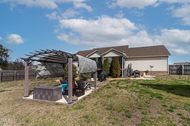 exterior space with a fenced backyard and a pergola