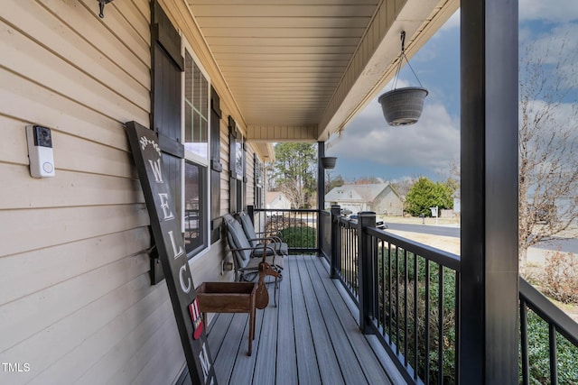 wooden deck featuring covered porch