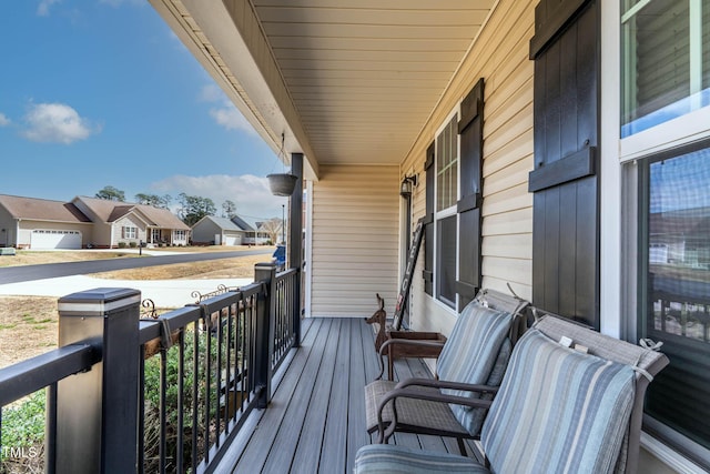 balcony featuring a porch and a residential view