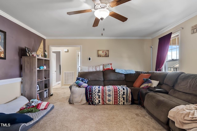 living room featuring ceiling fan, visible vents, carpet, and ornamental molding