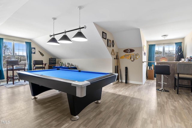 game room featuring vaulted ceiling, wood finished floors, and baseboards