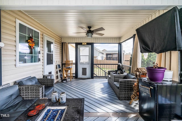 wooden terrace featuring ceiling fan