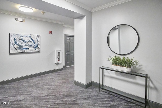 hallway with ornamental molding and baseboards