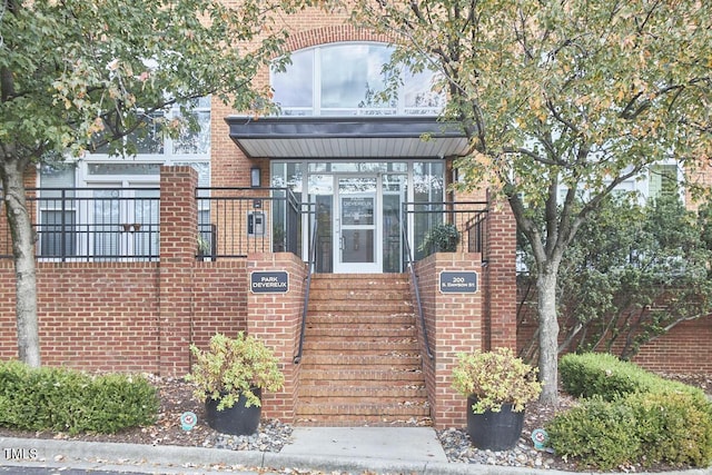 view of front of home featuring brick siding