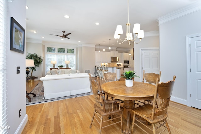 dining space with light wood finished floors, baseboards, ornamental molding, and recessed lighting