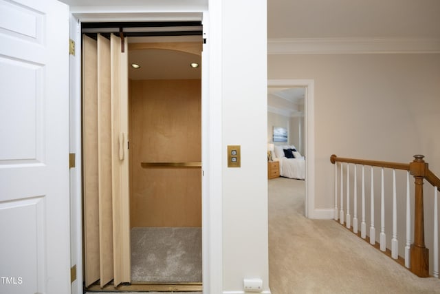 corridor with baseboards, elevator, ornamental molding, an upstairs landing, and carpet floors