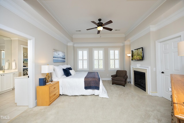 bedroom with ornamental molding, light carpet, a fireplace, and visible vents