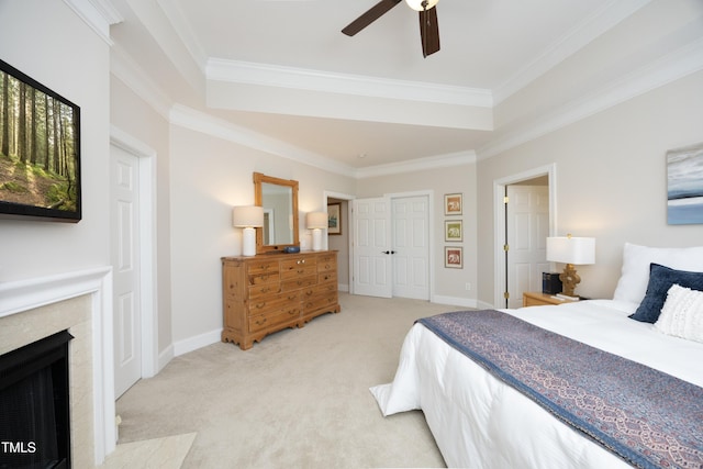 bedroom featuring light carpet, baseboards, a high end fireplace, and crown molding