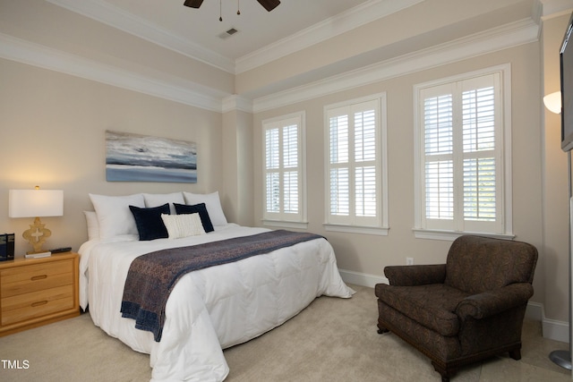 carpeted bedroom featuring baseboards, visible vents, ceiling fan, and crown molding