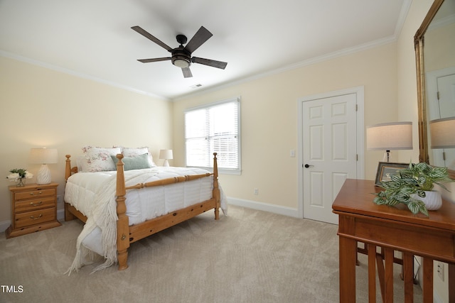 bedroom with ornamental molding, light colored carpet, visible vents, and baseboards