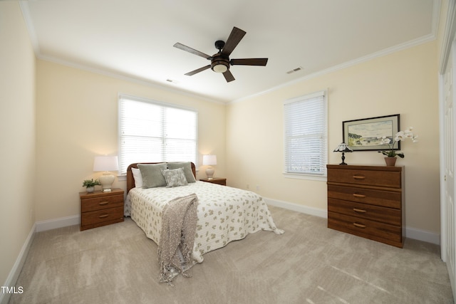 bedroom featuring baseboards, visible vents, crown molding, and light colored carpet