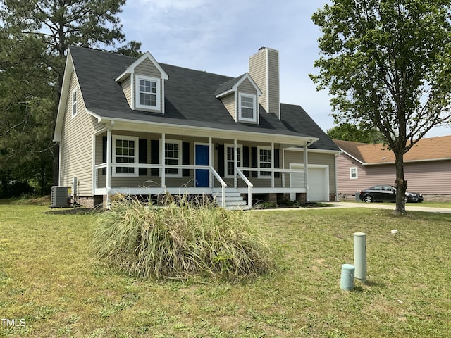 new england style home featuring a porch, a chimney, a front yard, a garage, and central AC
