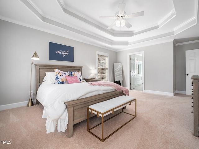 carpeted bedroom featuring baseboards, a raised ceiling, and ornamental molding