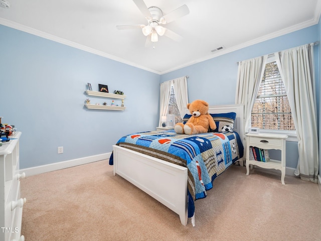 carpeted bedroom featuring visible vents, a ceiling fan, crown molding, and baseboards