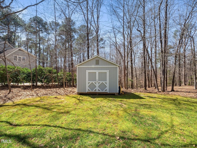 view of shed featuring a forest view