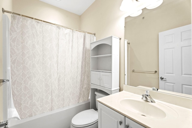 full bathroom with shower / tub combo with curtain, vanity, and toilet