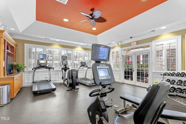 workout area featuring a tray ceiling, ornamental molding, a ceiling fan, and recessed lighting