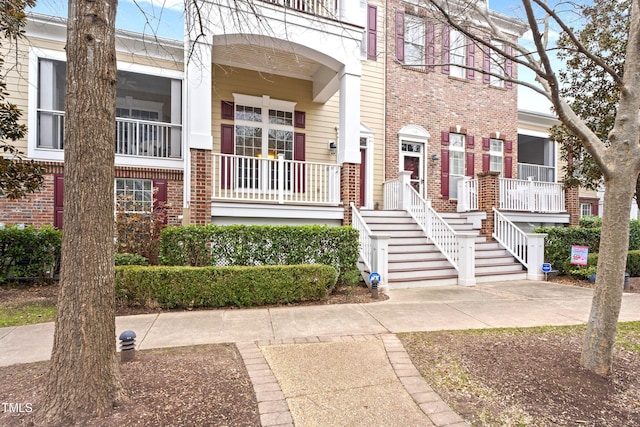 view of front of home featuring brick siding