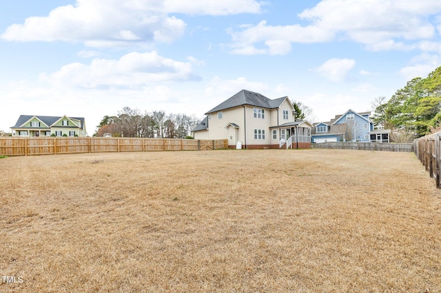 view of yard with a fenced backyard