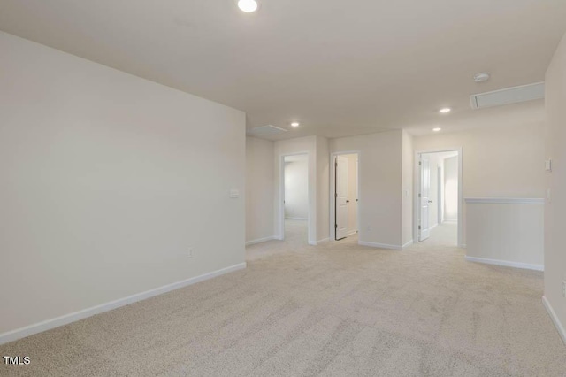 unfurnished room with recessed lighting, light carpet, and baseboards