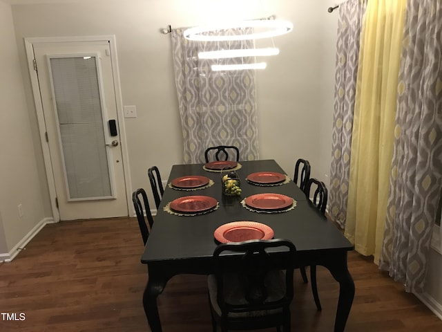 dining space featuring wood finished floors