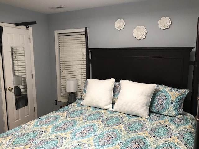 bedroom featuring visible vents