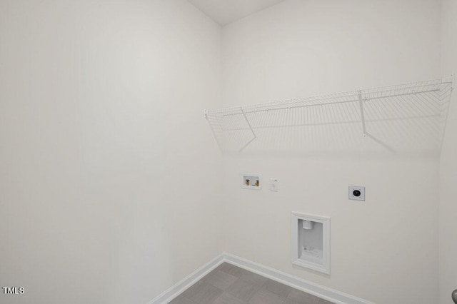 washroom with baseboards, laundry area, hookup for a washing machine, and hookup for an electric dryer