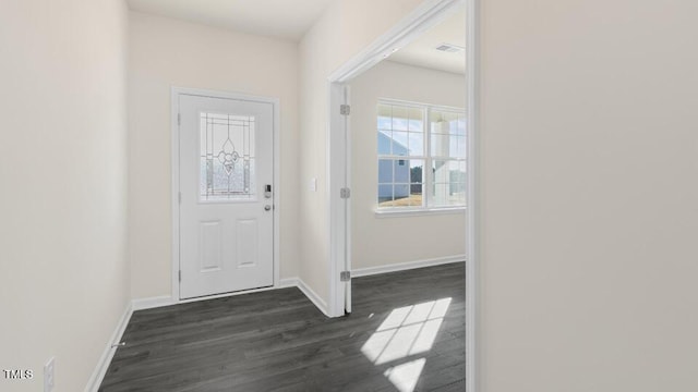 entryway with visible vents, dark wood finished floors, and baseboards