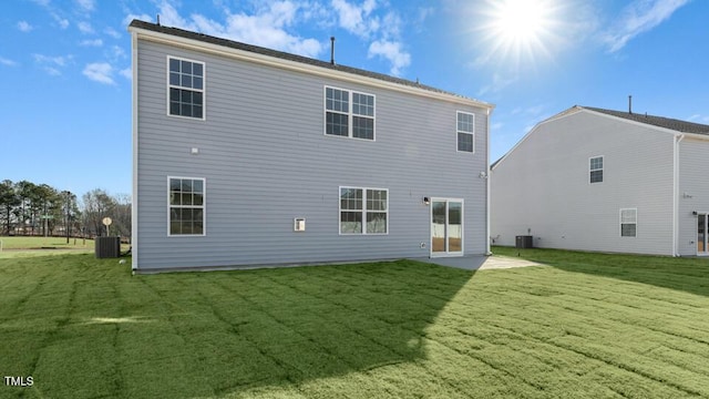 back of house featuring a yard, a patio, and cooling unit