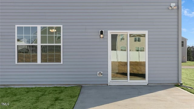 doorway to property featuring a patio